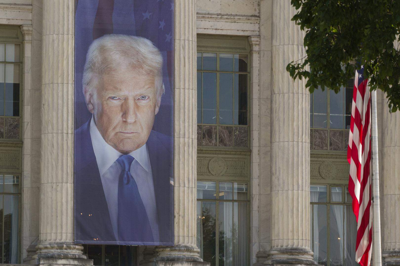 WASHINGTON, DC - MAY 26: A banner showing a picture of U.S. President Donald Trump is displayed outside of the U.S. Department of Agriculture building on May 26, 2025 in Washington, DC. (Photo by Kevin Carter/Getty Images)