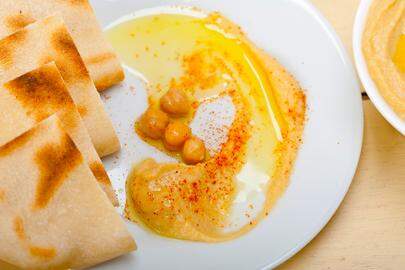 traditional chickpeas Hummus with pita bread and paprika on top