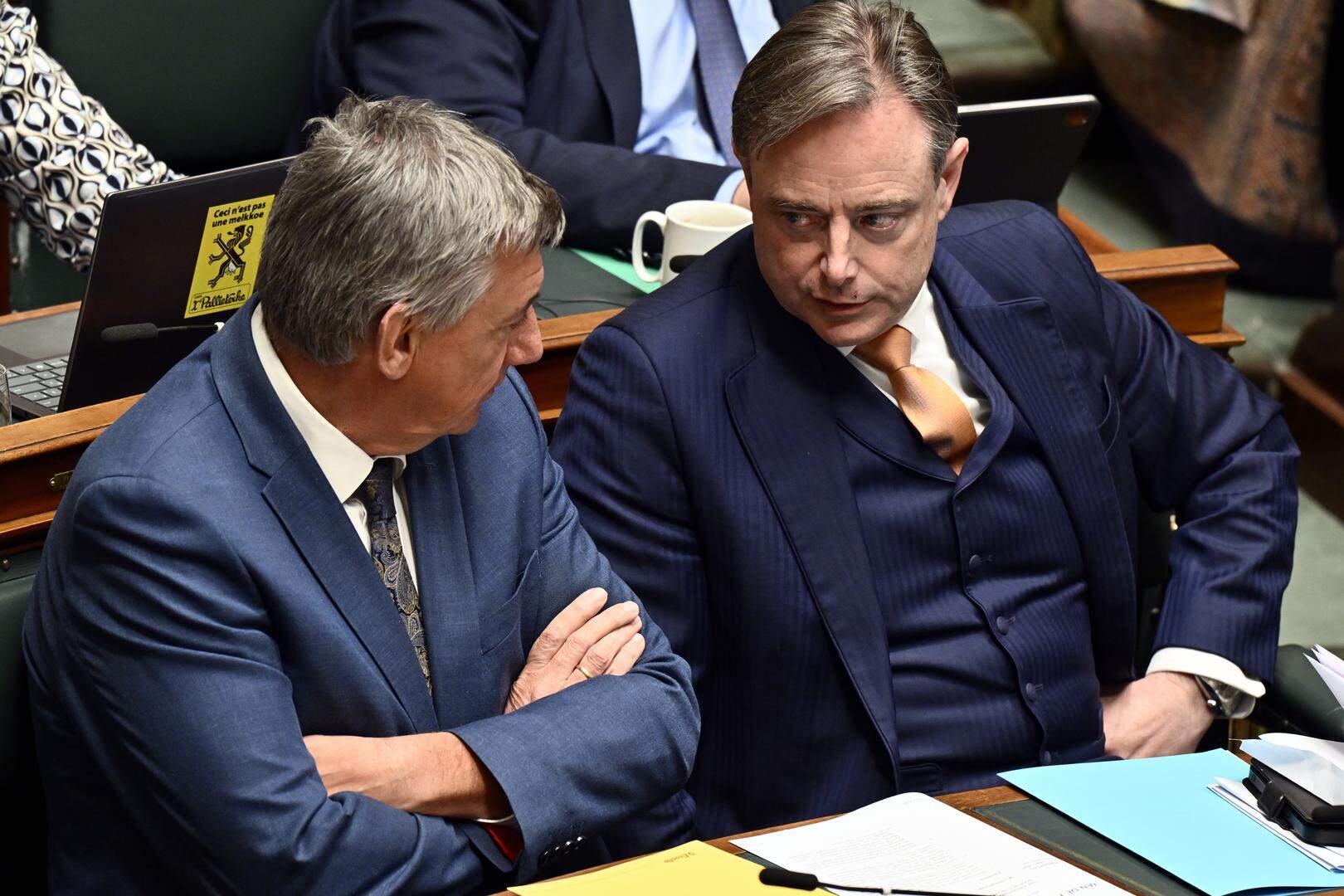 Vice-prime minister and Minister of Finance, Combating Tax Fraud, Pensions, National Lottery and Cultural Institutions Jan Jambon and Prime Minister Bart De Wever pictured during a plenary session of the Chamber at the Federal Parliament in Brussels, Thursday 13 March 2025. BELGA PHOTO ERIC LALMAND