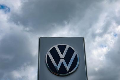 epa12252855 The Volkswagen logo is seen in front of the VW Berlin car dealership during a warning strike in Berlin, Germany, 22 July 2025.  EPA/FILIP SINGER