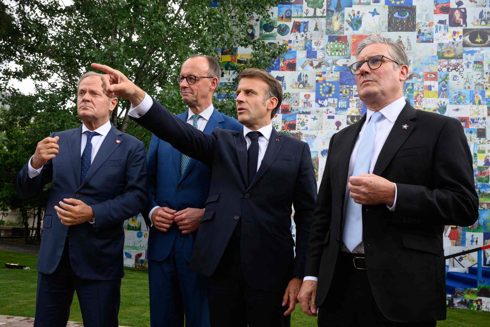 (From L) Poland's Prime Minister Donald Tusk, Germany's Chancellor Friedrich Merz, France's President Emmanuel Macron and Britain's Prime Minister Keir Starmer talk to the press after their meeting during the European Political Community (EPC) summit, in Tirana on May 16, 2025. (Photo by Leon Neal / POOL / AFP)