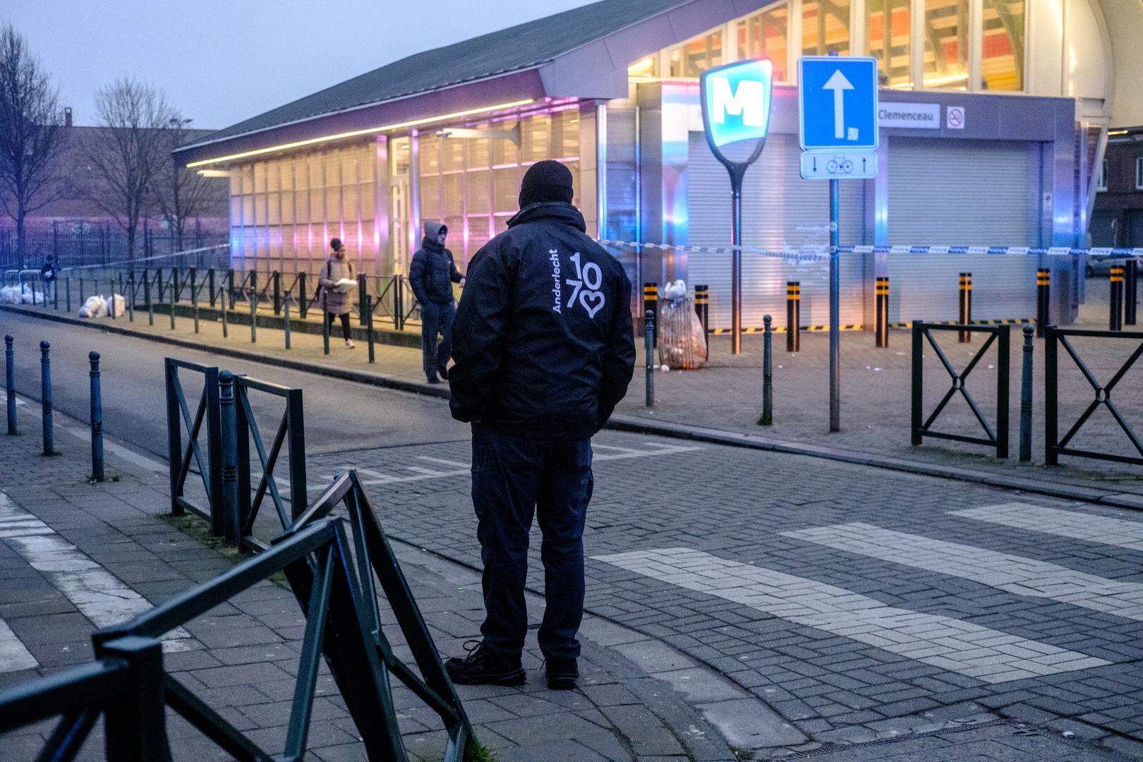 A resident wearing a sweater 'Anderlecht 1070' written on it, pictured near the Clemenceau metro station, which is closed off after a shooting this morning, Thursday 06 February 2025 in Cureghem - Kuregem, Anderlecht, Brussels. It's the second day in a row that a shooting has taken place near the metro station. One person was injured.
BELGA PHOTO HATIM KAGHAT