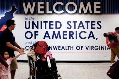 A family exits after clearing immigration and customs at Dulles International Airport in Dulles, Virginia, U.S. September 24, 2017. REUTERS/James Lawler Duggan