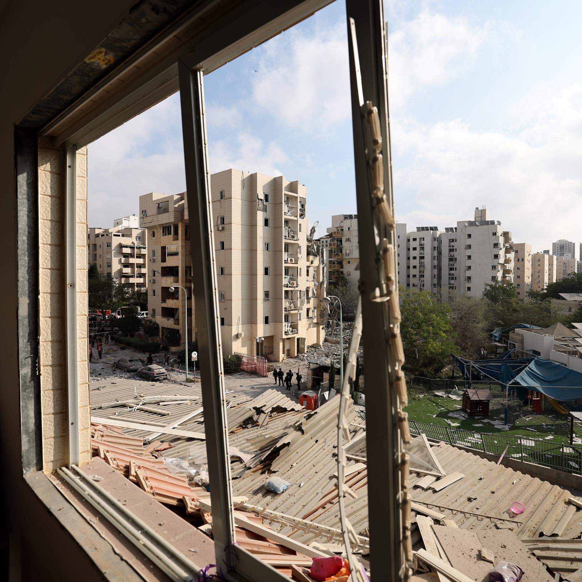 epa12194058 A damaged window at the site of a missile strike on a residential area in Be'er Sheva, southern Israel, 24 June 2025. Israel's military stated Iran launched a barrage of ballistic missiles at Israel overnight. Magen David Adom (MDA), Israel's national emergency services, reported at least four killed and dozens injured in southern Israel.  EPA/ATEF SAFADI