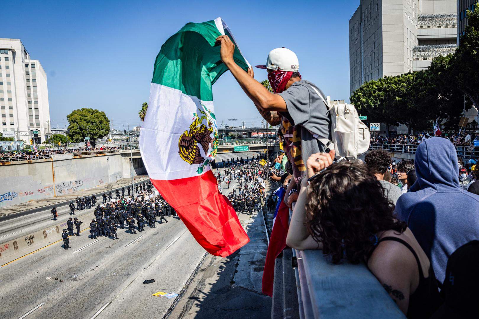 Los Angeles, CA - June 08: Protesters shutdown the 101 Freeway as they clash with law enforcement in downtown Los Angeles due to the immigration raids in L.A. on Sunday, June 8, 2025 in Los Angeles, CA. (Jason Armond / Los Angeles Times via Getty Images)