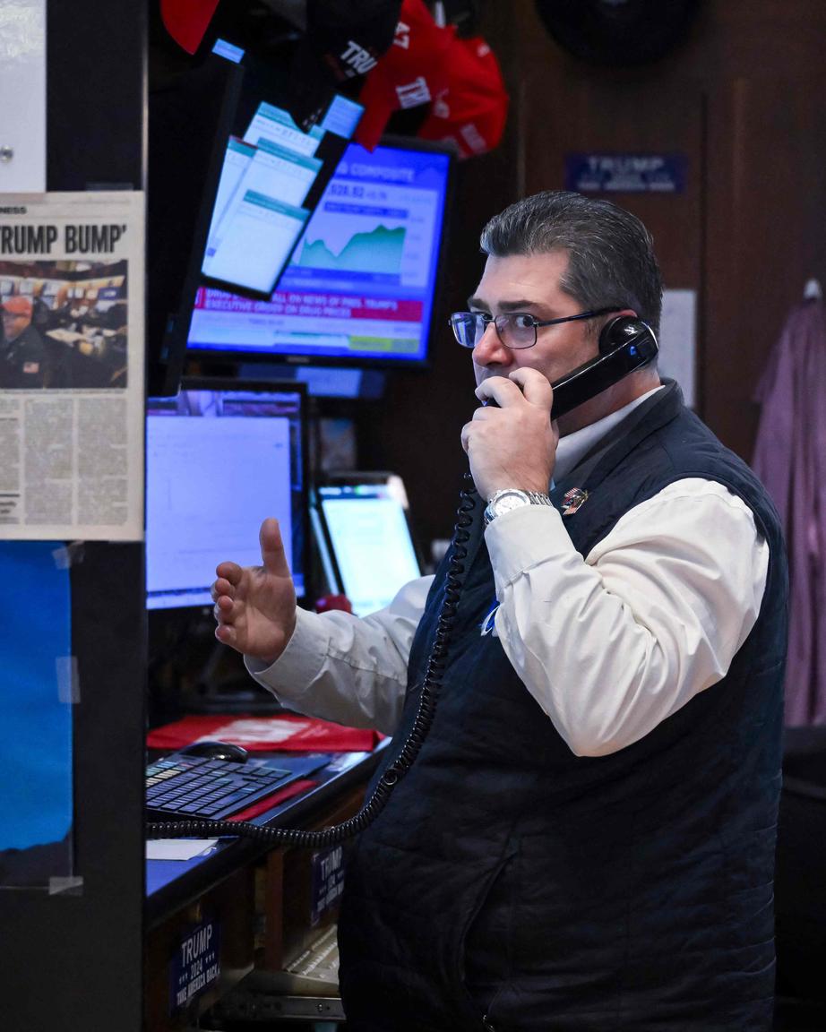 Traders work on the floor of the New York Stock Exchange (NYSE) at the opening bell on May 12, 2025, in New York City. (Photo by ANGELA WEISS / AFP)