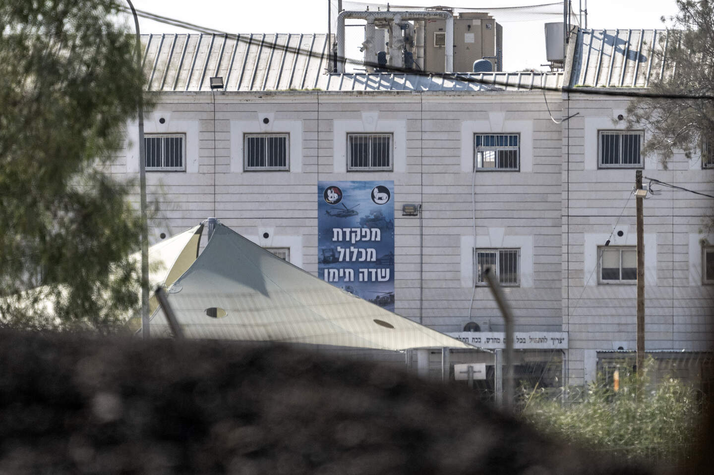 NEGEV, ISRAEL - JAN 10: A view of Sde Teiman prison in the Negev desert near the Gaza Strip, in Negev, Israel on January 10, 2025. In a joint statement by the Palestine Liberation Organization (PLO)'s Prisoners and Freedmen's Committee and the Palestinian Prisoners Society, it was reported that 10,400 Palestinians were imprisoned in Israeli prisons as of January 1, 2025. The fate of thousands of Palestinians detained by Israeli forces in Gaza is unknown. Most of the detained Palestinians are held in Sde Teiman prison in the Negev desert near the Gaza Strip. (Photo by Mostafa Alkharouf/Anadolu via Getty Images)