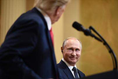 US President Donald Trump and Russia's President Vladimir Putin attend a joint press conference after a meeting at the Presidential Palace in Helsinki, on July 16, 2018. 
Brendan SMIALOWSKI / AFP