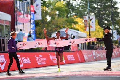 Oct 13, 2024; Chicago, IL, USA; Ruth Chepngetich of Kenya finishes first in the womens race, setting a new world record at 2:09:56 during the Chicago Marathon at Grant Park. Mandatory Credit: Patrick Gorski-Imagn Images