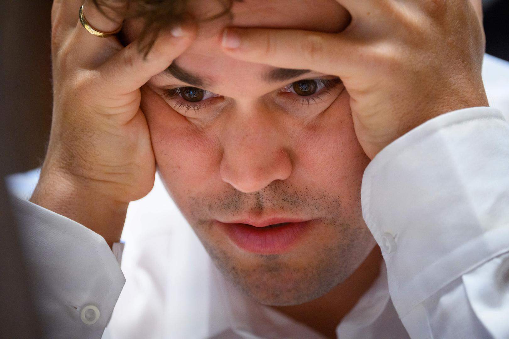 07 February 2025, Schleswig-Holstein, Wangels: Magnus Carlsen, world number one in the World Chess Federation rankings, looks at the chessboard during the Freestyle Chess Grand Slam at the Weissenhaus Private Nature Luxury Resort in Wangels. Photo: Gregor Fischer/dpa (Photo by Gregor Fischer/picture alliance via Getty Images)
