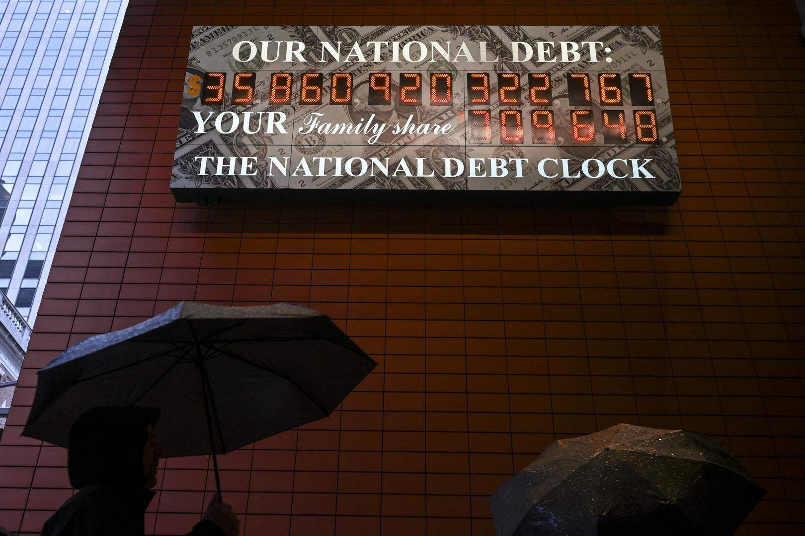 A screen displaying the US national debt is seen in the Manhattan borough of New York City on April 11, 2025. China said Friday it would raise its tariffs on US goods to 125 percent in a further escalation of a trade war that threatens to bring exports to a halt between the world's two biggest economies. Beijing's retaliation sparked fresh market volatility, with stocks seesawing, gold prices surging and US government bonds under pressure. (Photo by ANGELA WEISS / AFP)