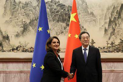 Chinese Vice Premier Ding Xuexiang and EU Executive Vice-President for a Clean, Just and Competitive Transition, Teresa Ribera shake hands at the Diaoyutai State Guesthouse in Beijing on July 14, 2025. (Photo by FLORENCE LO / POOL / AFP)